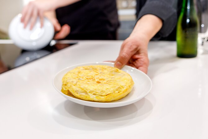 Authentic Tapas Cooking Class at a Private Local Eatery in Madrid - Cooking Spanish food instead of just ordering it