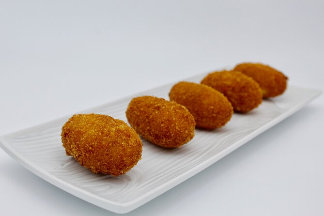 Authentic Tapas Cooking Class at a Private Local Eatery in Madrid - Wine, conversation, and the social side