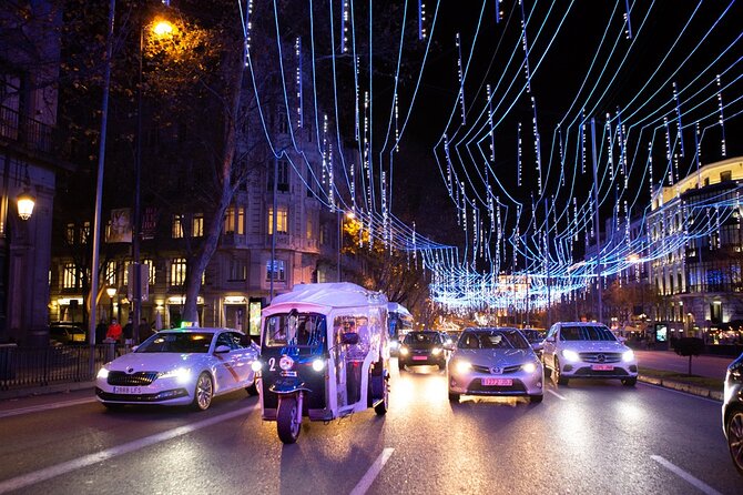 Christmas Lights Tour of Madrid in Eco Tuk Tuk Private - Columbus Square connects gardens, sculpture, and culture