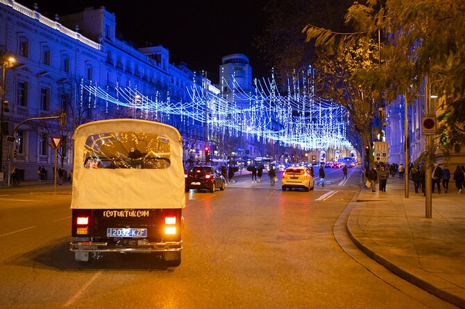 Christmas Lights Tour of Madrid in Eco Tuk Tuk Private - Congress brings neoclassical drama