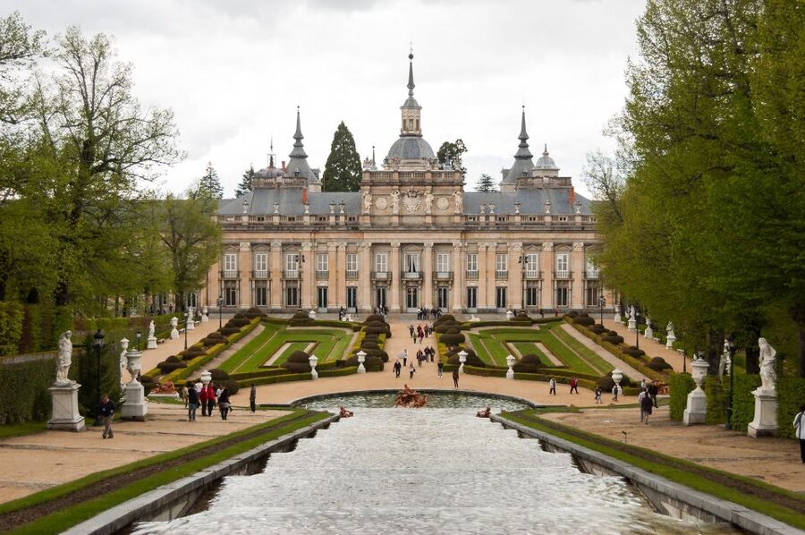From Madrid: Segovia & La Granja Private Full-Day Tour - Entering Segovia beneath the Roman aqueduct