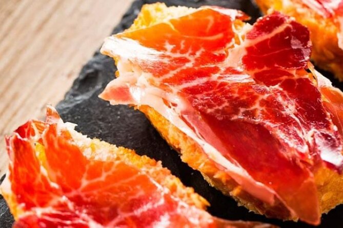 Gastronomic Tour: Discover the best “Wines and Tapas of Madrid” - Mercado Jamón Ibérico and the food behind the slice