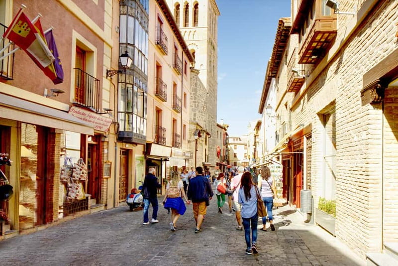 Madrid: 6-Hour Day Trip to Toledo with Guided Walking Tour - Entering the old town through its layered past