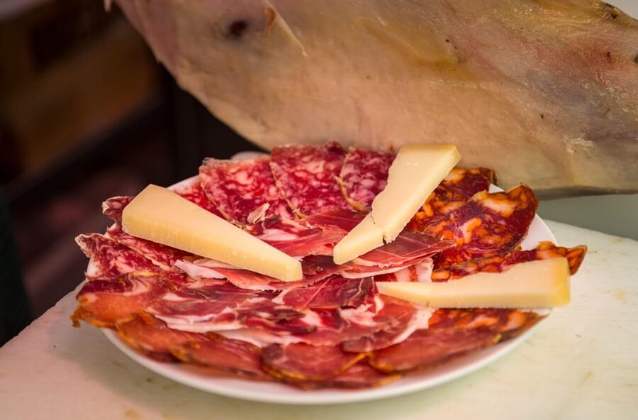 Madrid: Authentic Tapas Evening Tour with a side of History - The first two bars: standing, snacking, and tapeo
