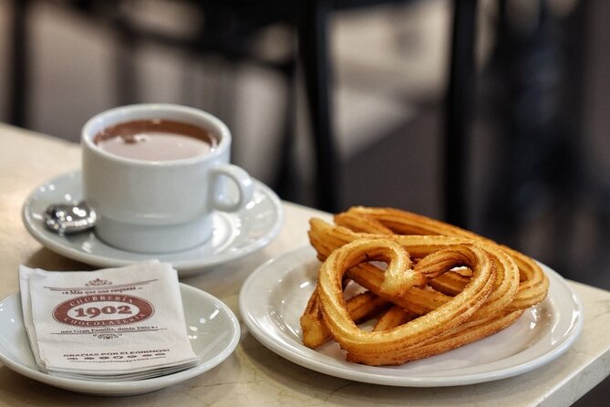 Madrid Bike Tour with Churros and Wine, Ham, and Cheese Upgrade - The Prado area without a museum ticket
