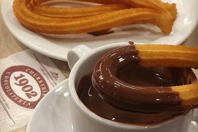 Madrid Bike Tour with Churros and Wine, Ham, and Cheese Upgrade - Puerta de Alcalá and the royal park
