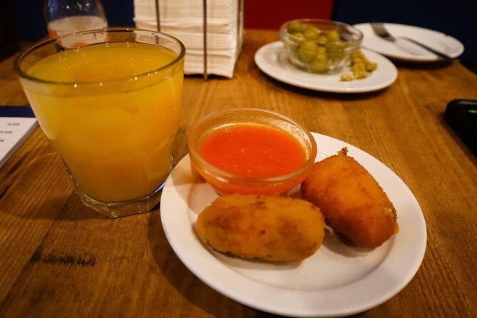 Madrid Food Tasting Tour of Hidden Gems (Small Groups) - Stops three and four: jamón, tortilla, and vermouth
