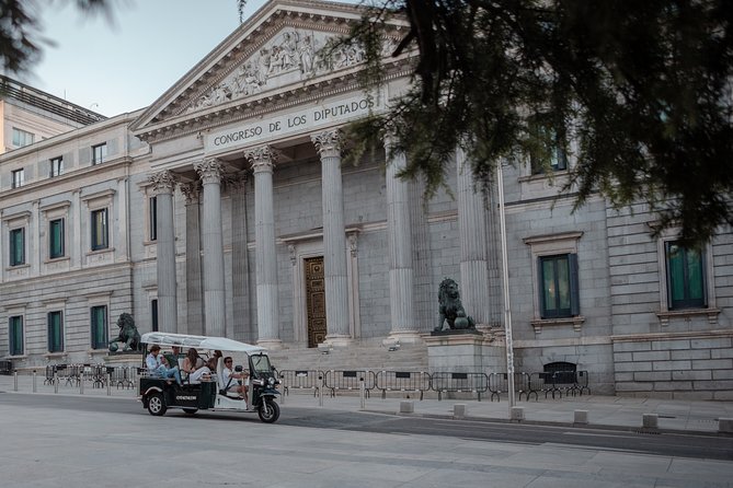Madrid Historical Tour with Local Guide in Eco Tuk Tuk Private - Puerta de Alcalá and the grand east side