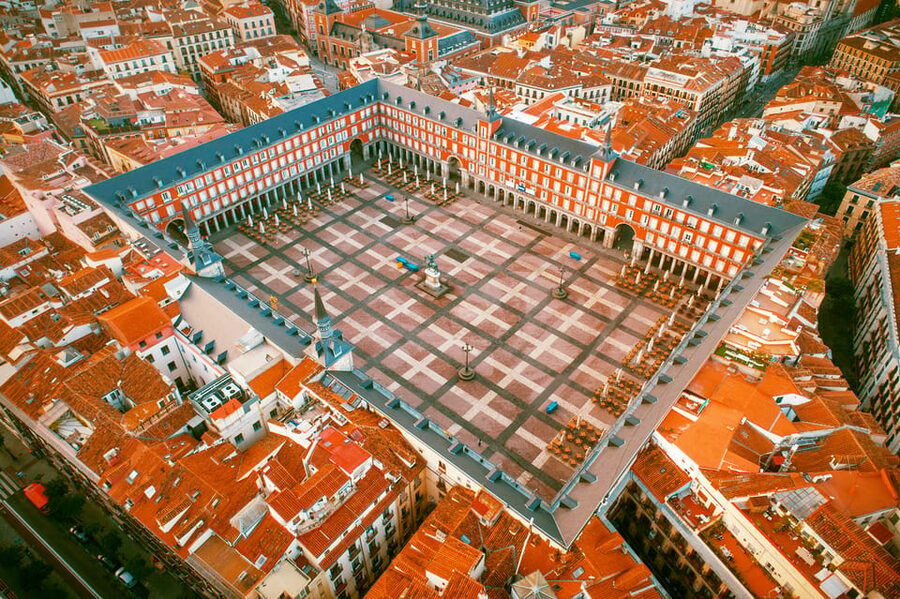Madrid: History, Bites & Sips – An Intimate Tour Since 2018 - Starting beneath Plaza Mayor’s painted facades