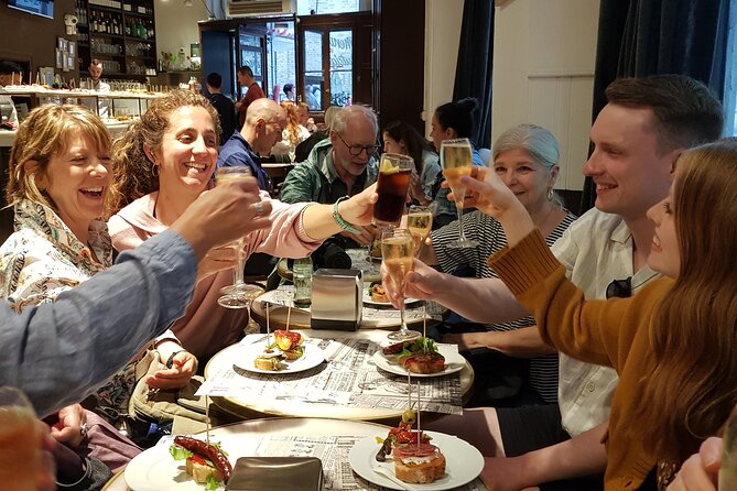 Madrid History Food Tour: Tapas & Drinks Tasting - Jamón Ibérico, Manchego, and grilled mushrooms