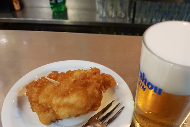 Madrid History Food Tour: Tapas & Drinks Tasting - Croquetas, empanadillas, and fried bacalao