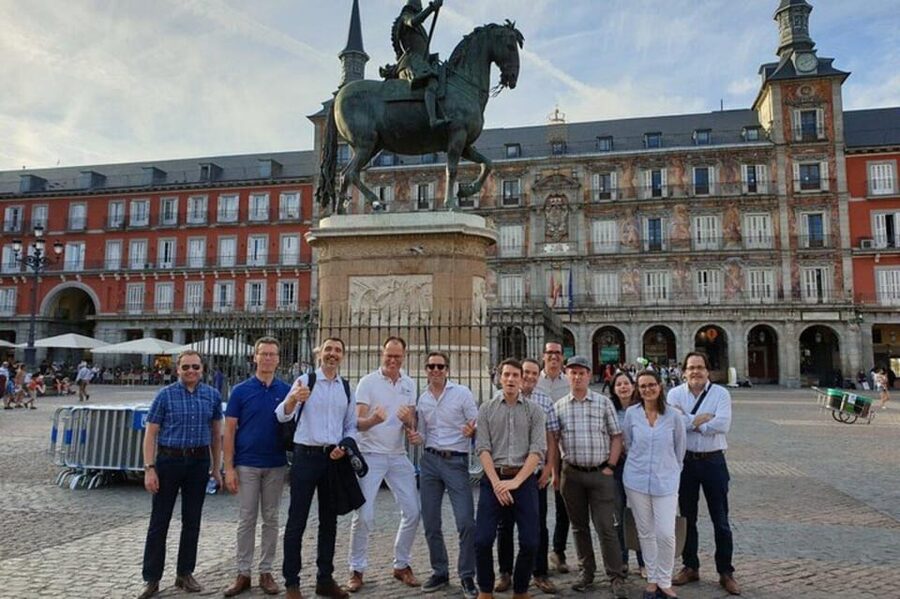 Madrid: Must-See Attractions Walking Tour - Passing an old city gate at Plaza de Pontejos