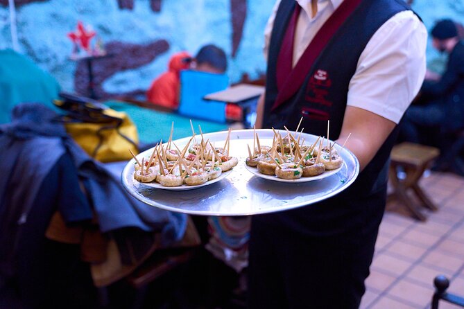 Madrid: Not Just Another Tapas & Wine Tour by Eating Europe - Mesón del Champiñón and Madrid’s old tavern culture