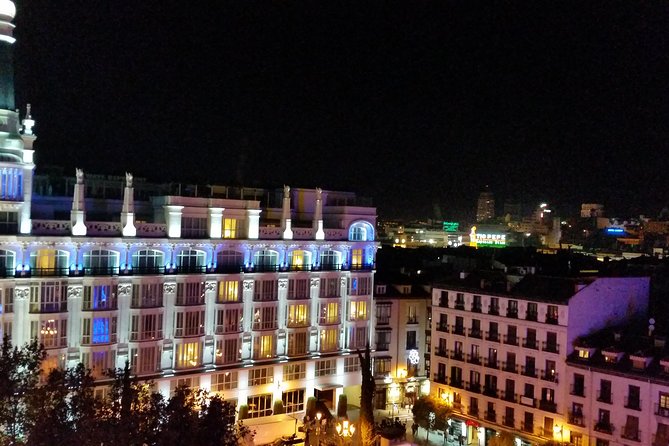 Madrid Private Night Walking Custom Tour with Tapa and a Drink - The Royal Palace beneath evening lights