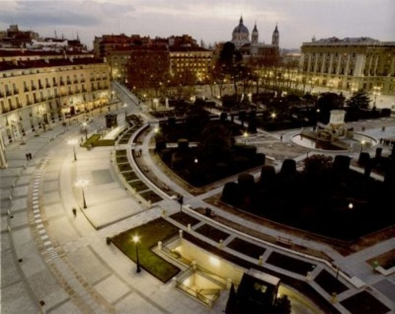Madrid: Sunset and Night Lights eBike Tour - Almudena Cathedral and the Royal Palace after dark