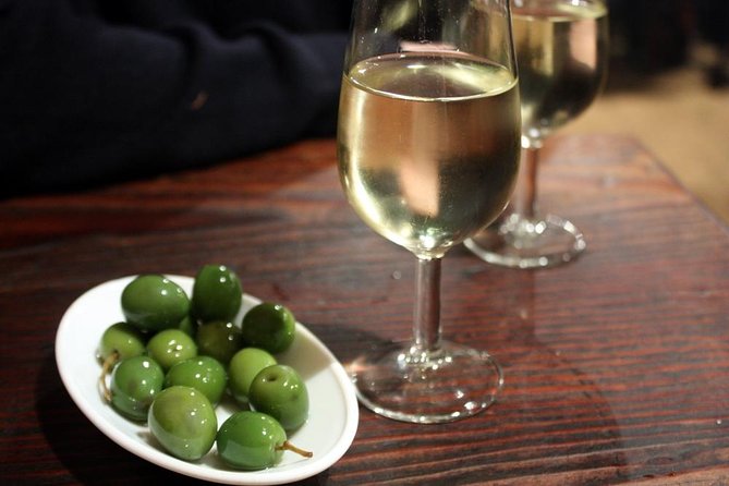 Madrid Tapas Experience Walking Tour - Wineskin pours, cider, and the social side