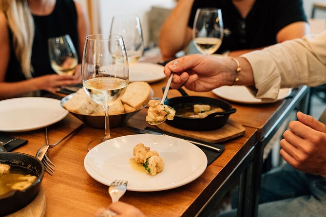Madrid Tapas & Wine Tour with Rooftop Views and Local Guide - Huertas and slow-cooked beef cheeks