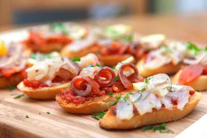 Tasty Tapas & Drinks Tour with a Rooftop Included - A food walk that uses Madrid’s neighborhoods well