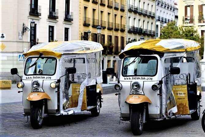 Tour of Historic and Modern Madrid with a guide in a yellow tuk tuk - Starting at Plaza de Isabel II